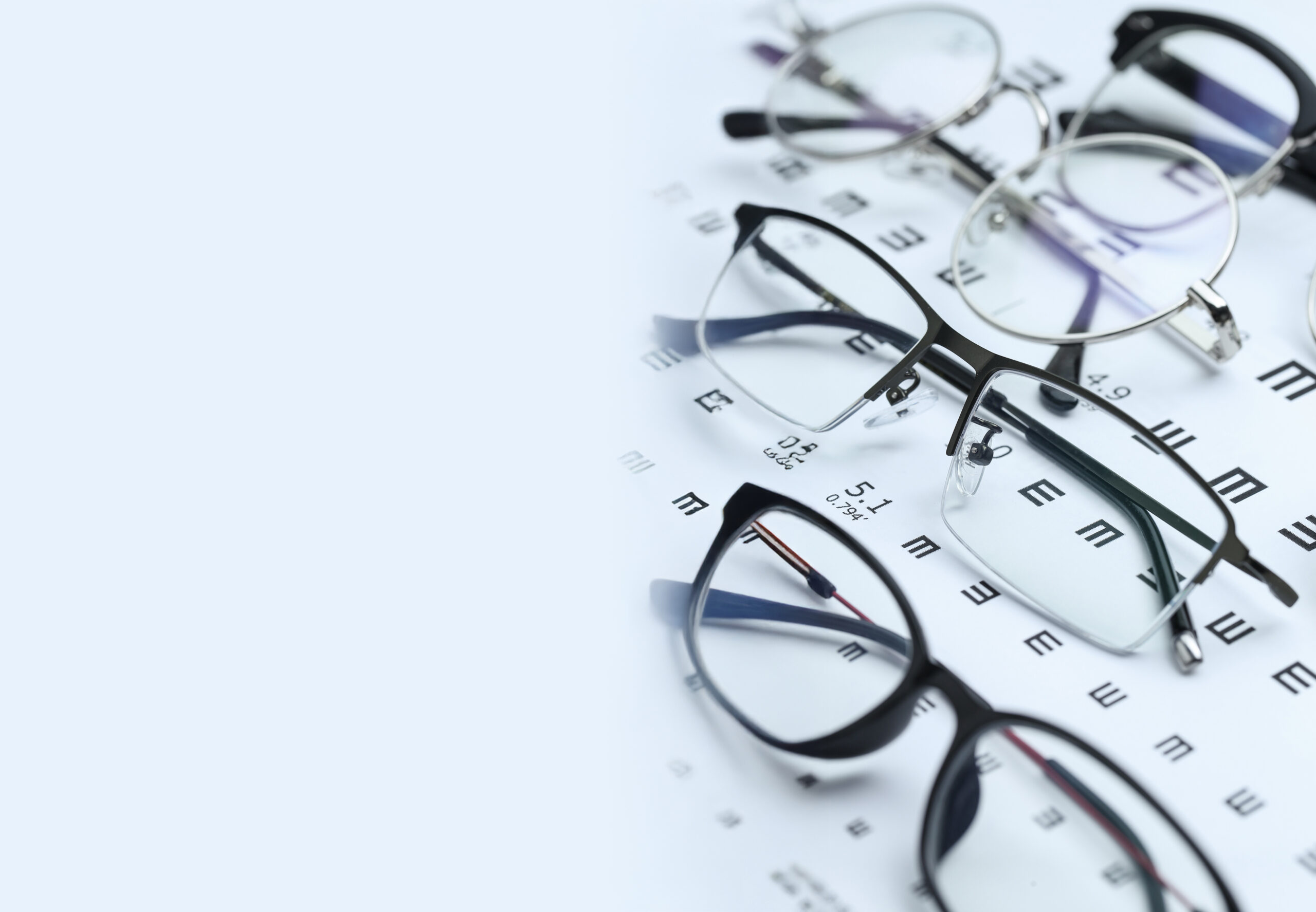 Detailed titanium eyewear frames arranged for review