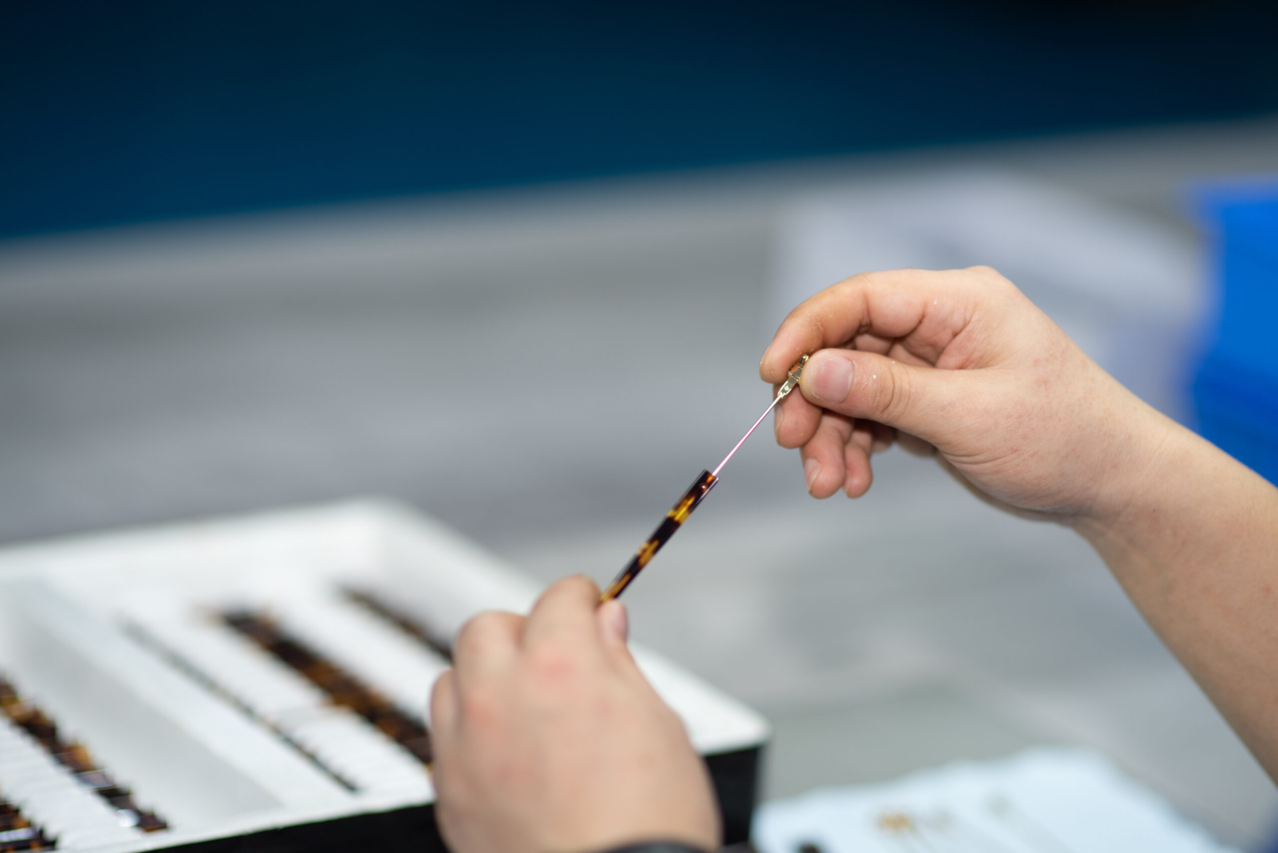Hinge assembly during eyewear production